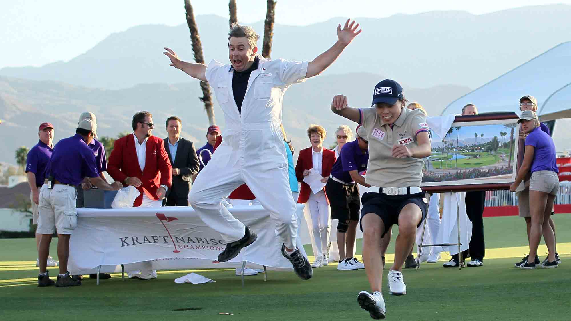 Sun Young Yoo of Korea and caddie Adam Woodward take the traditional leap