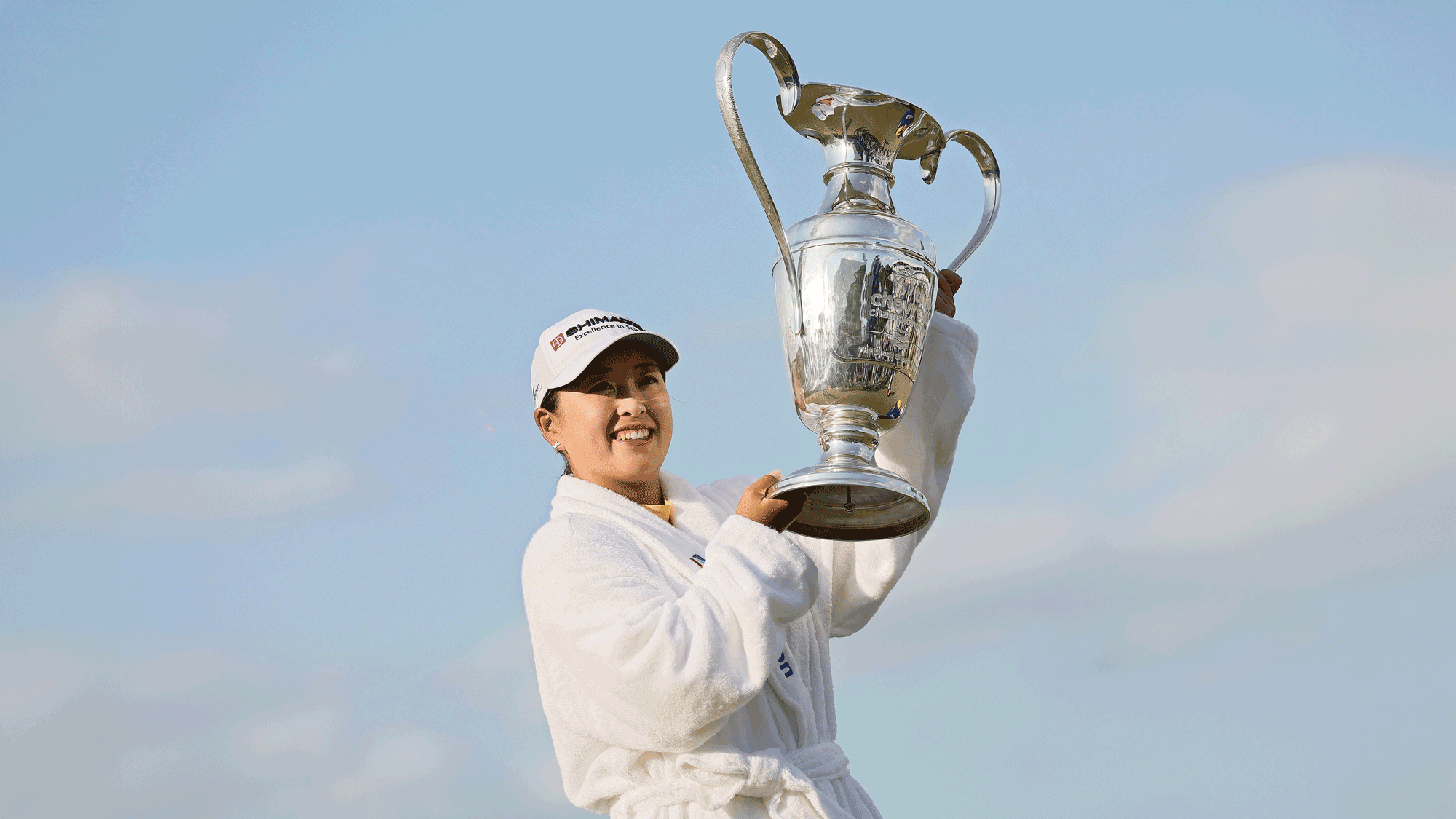 Mao Saigo of Japan poses with the trophy after winning The Chevron Championship 2025 in a playoff at The Club at Carlton Woods on April 27, 2025 in The Woodlands, Texas.